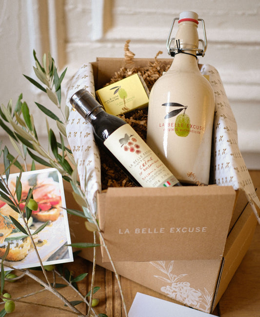 La Belle Excuse Thank You Gift Set featuring a ceramic cruet with extra virgin green olive oil, balsamic glaze, and kitchen soap.
