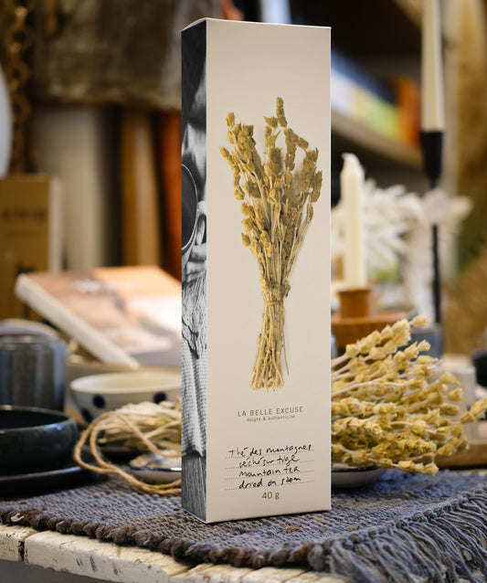 La Belle Excuse Greek Mountain Tea dried on the stem, a naturally caffeine-free herbal infusion with delicate floral, citrus, and mint notes.
