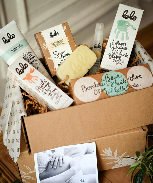 LOLO A Treat for Moms Gift Set featuring olive oil belly and body cream, lavender and chamomile Castile soap, lotion, pillow mist, bath bombs, and massage oil.

