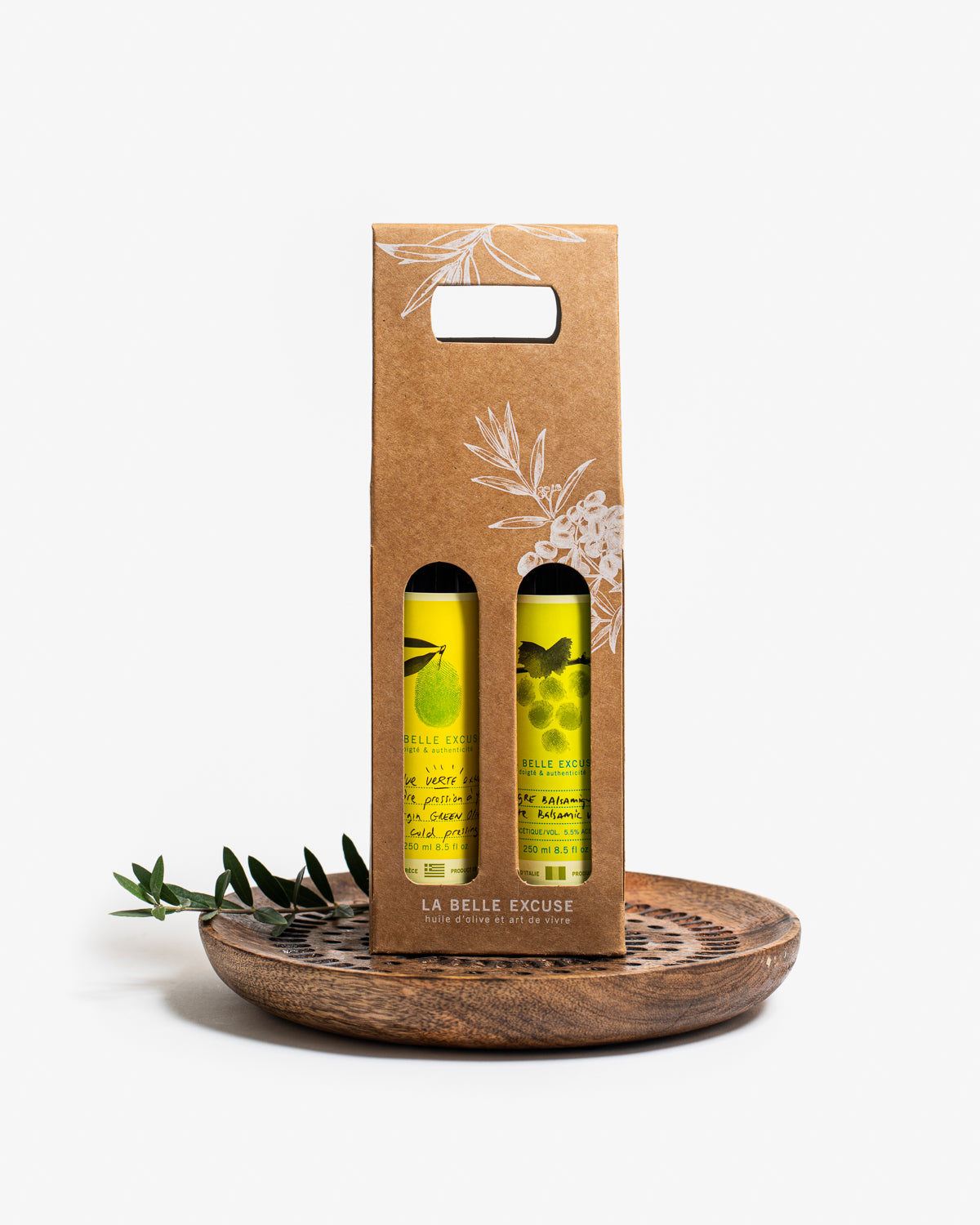 La Belle Excuse Olive Oil and Balsamic Vinegar Gift Box featuring a 250 ml bottle of green or black olive oil paired with a balsamic vinegar.
