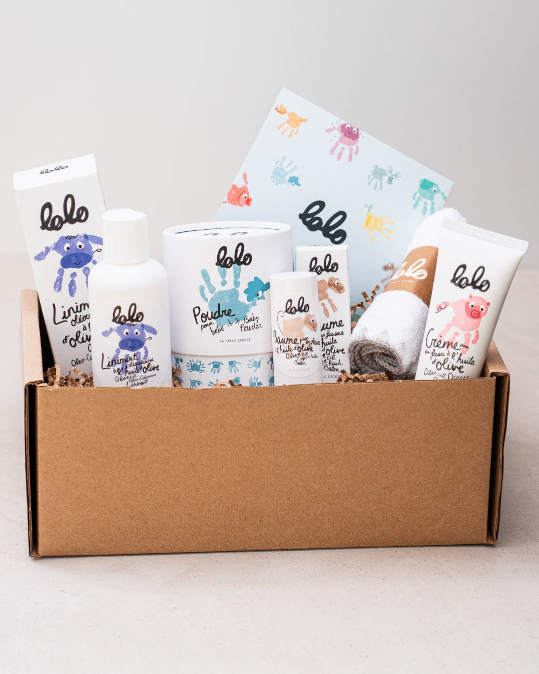 LOLO Diaper Changing Essentials Set featuring olive oil liniment (125 ml), diaper rash balm (12 g), diaper rash cream (75 ml), and baby powder (120 g).
