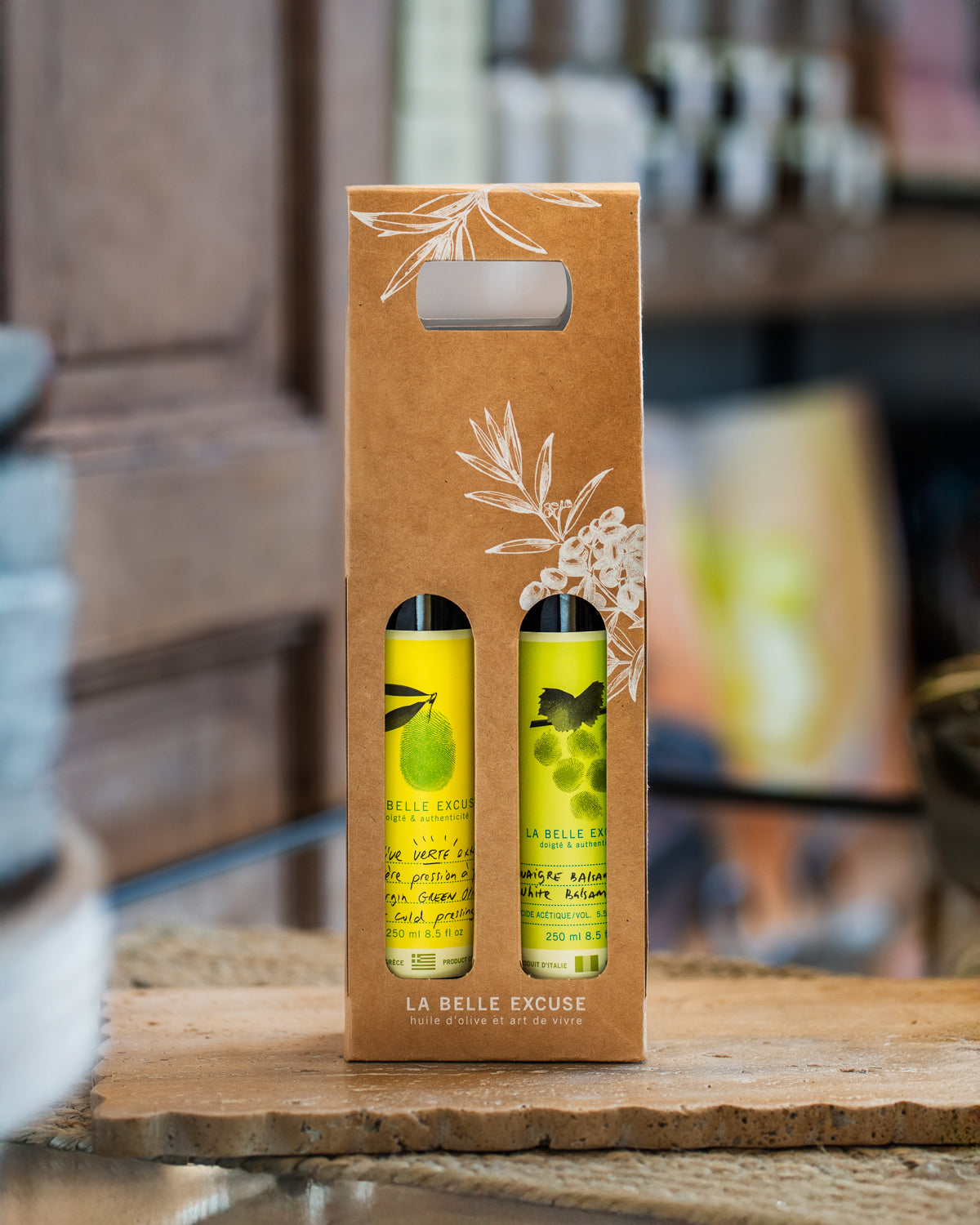 La Belle Excuse Olive Oil and Balsamic Vinegar Gift Box featuring a 250 ml bottle of green or black olive oil paired with a balsamic vinegar.