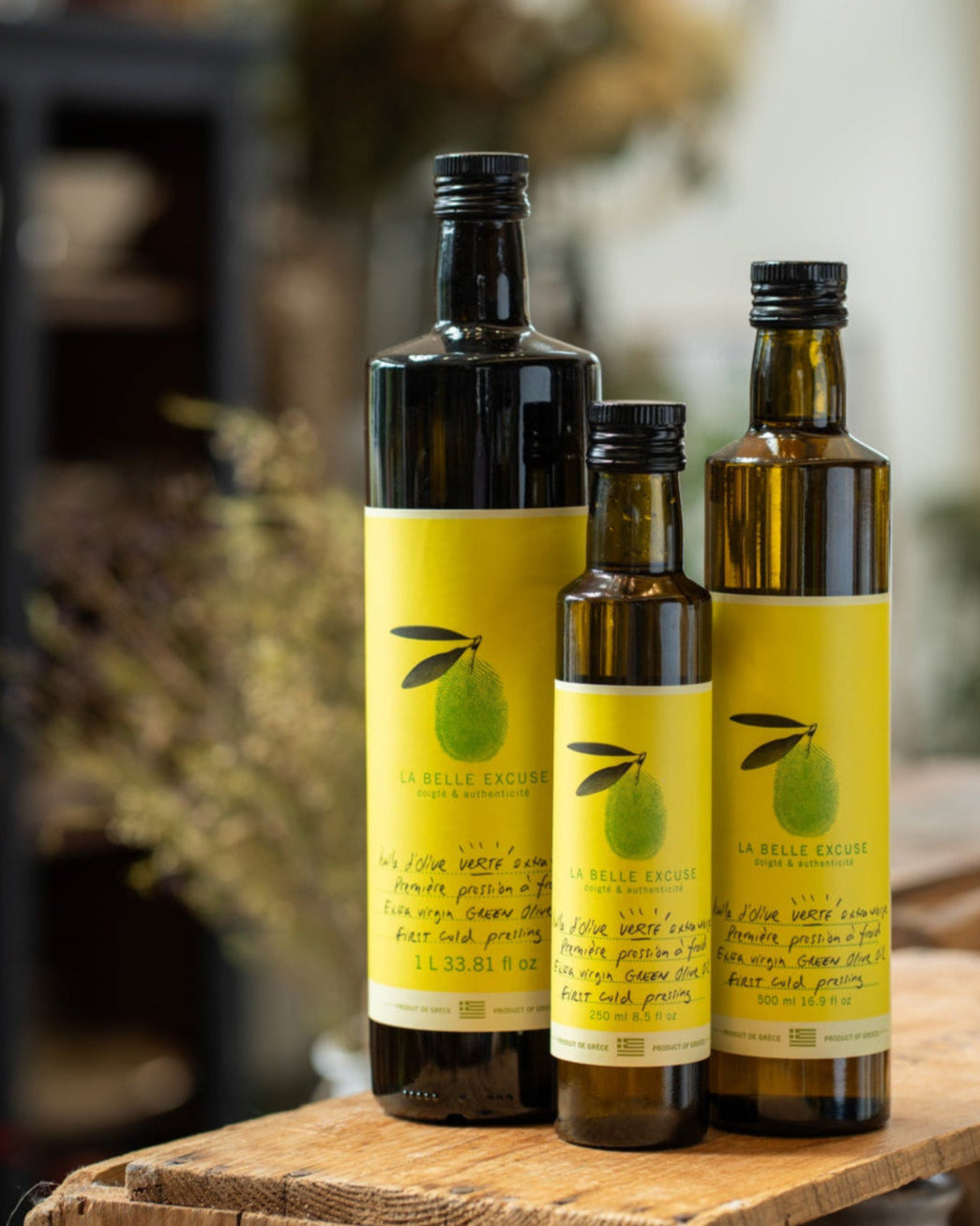 La Belle Excuse Extra Virgin Green Olive Oil, made with Greek olives—available in 250 ml, 500 ml, and 1 L formats.