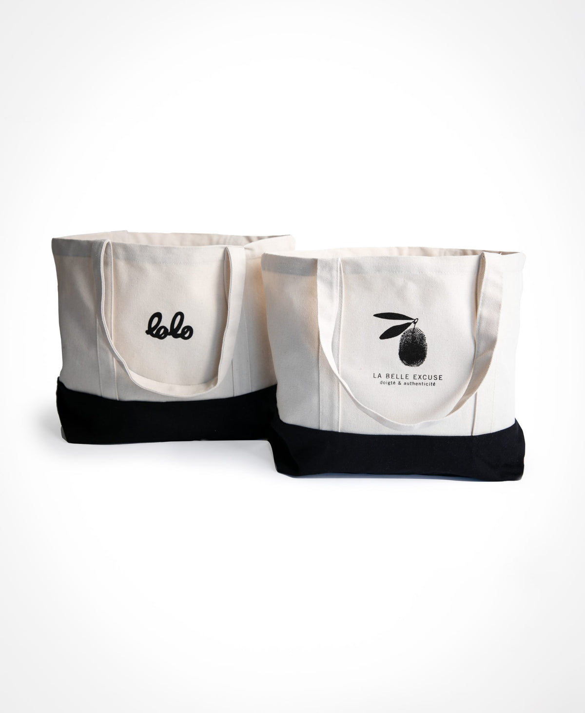La Belle Excuse and Lolo large white reusable tote bag with a black trim.