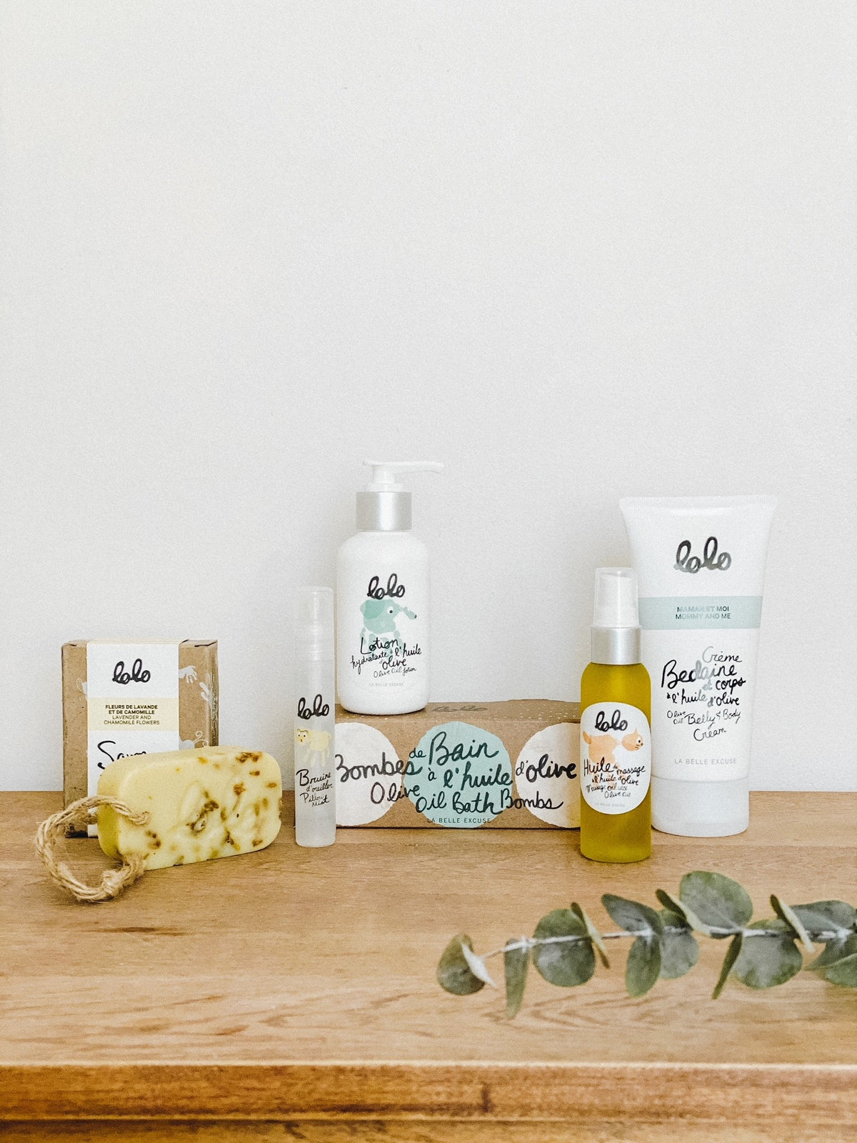LOLO A Treat for Moms Gift Set featuring olive oil belly and body cream, lavender and chamomile Castile soap, lotion, pillow mist, bath bombs, and massage oil.